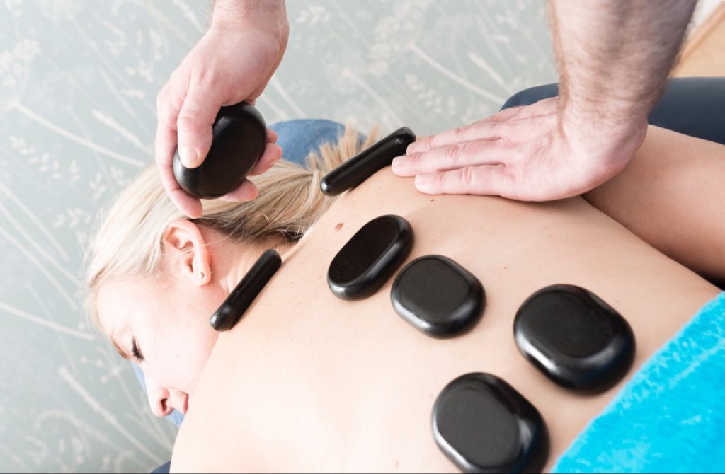 Massage with hot stones