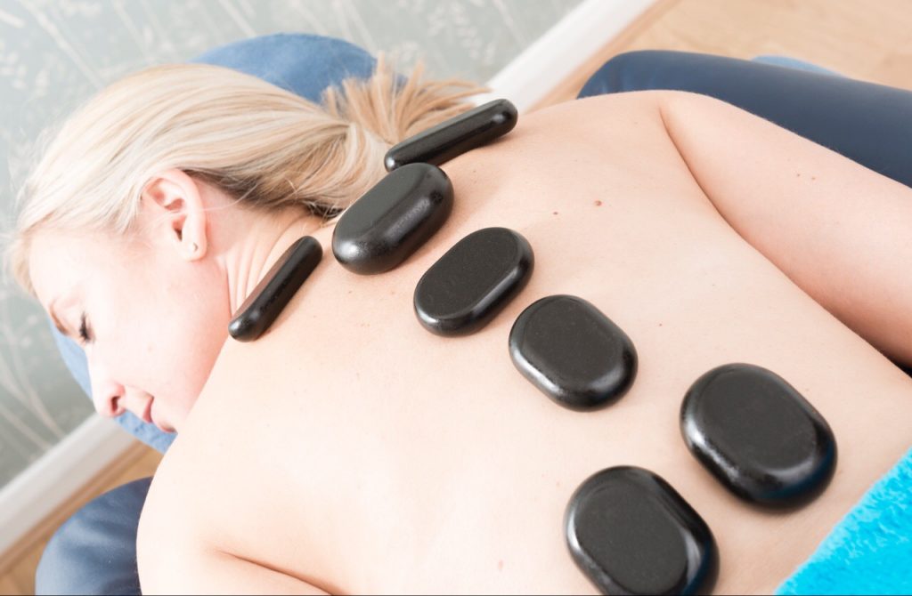 Hot stone massage soothes sore muscles
